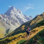 Hiker wearing down jacket and hiking boots on trail