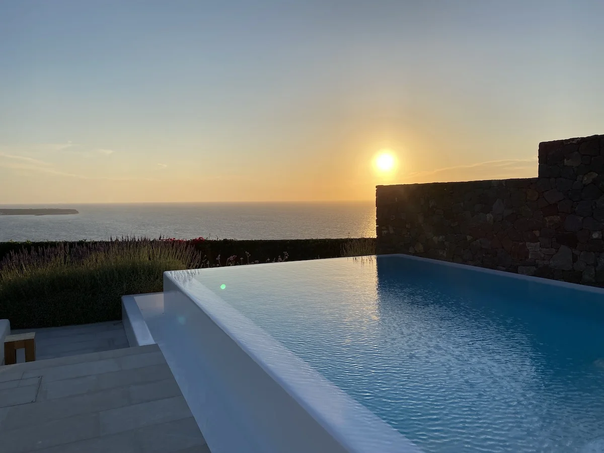 Infinity pool overlooking the ocean at sunset